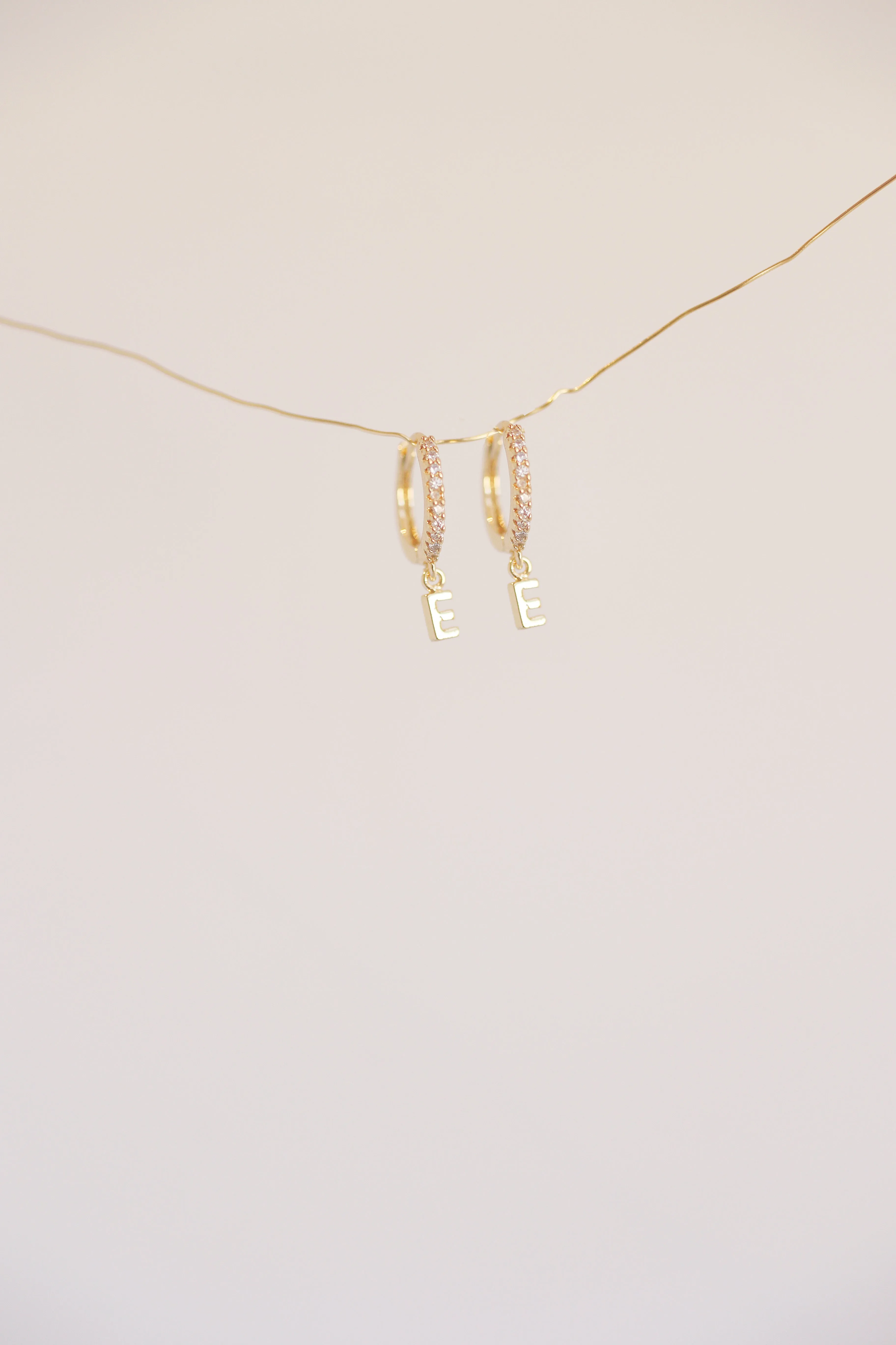 The Mini Monogram Huggie Earrings