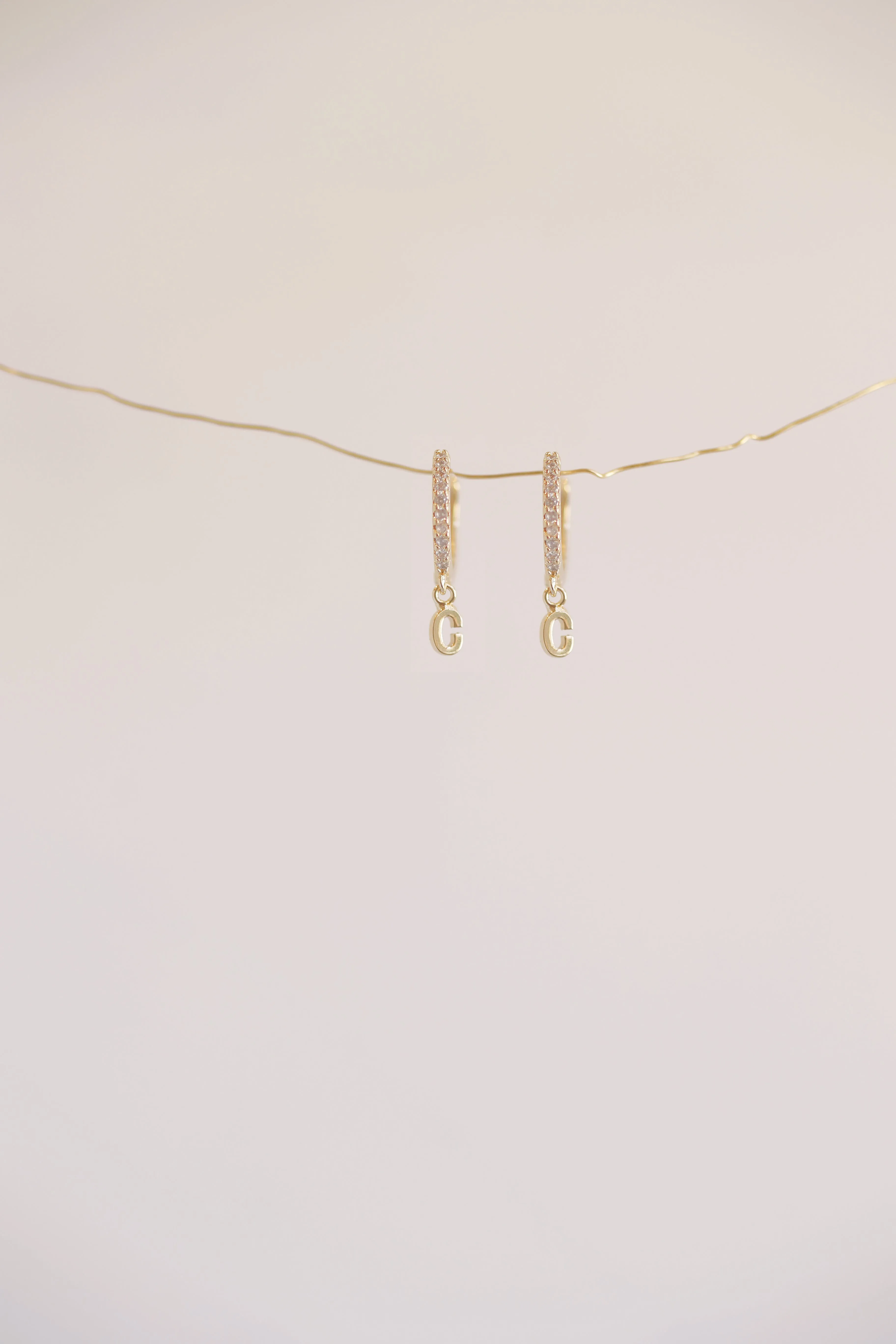 The Mini Monogram Huggie Earrings