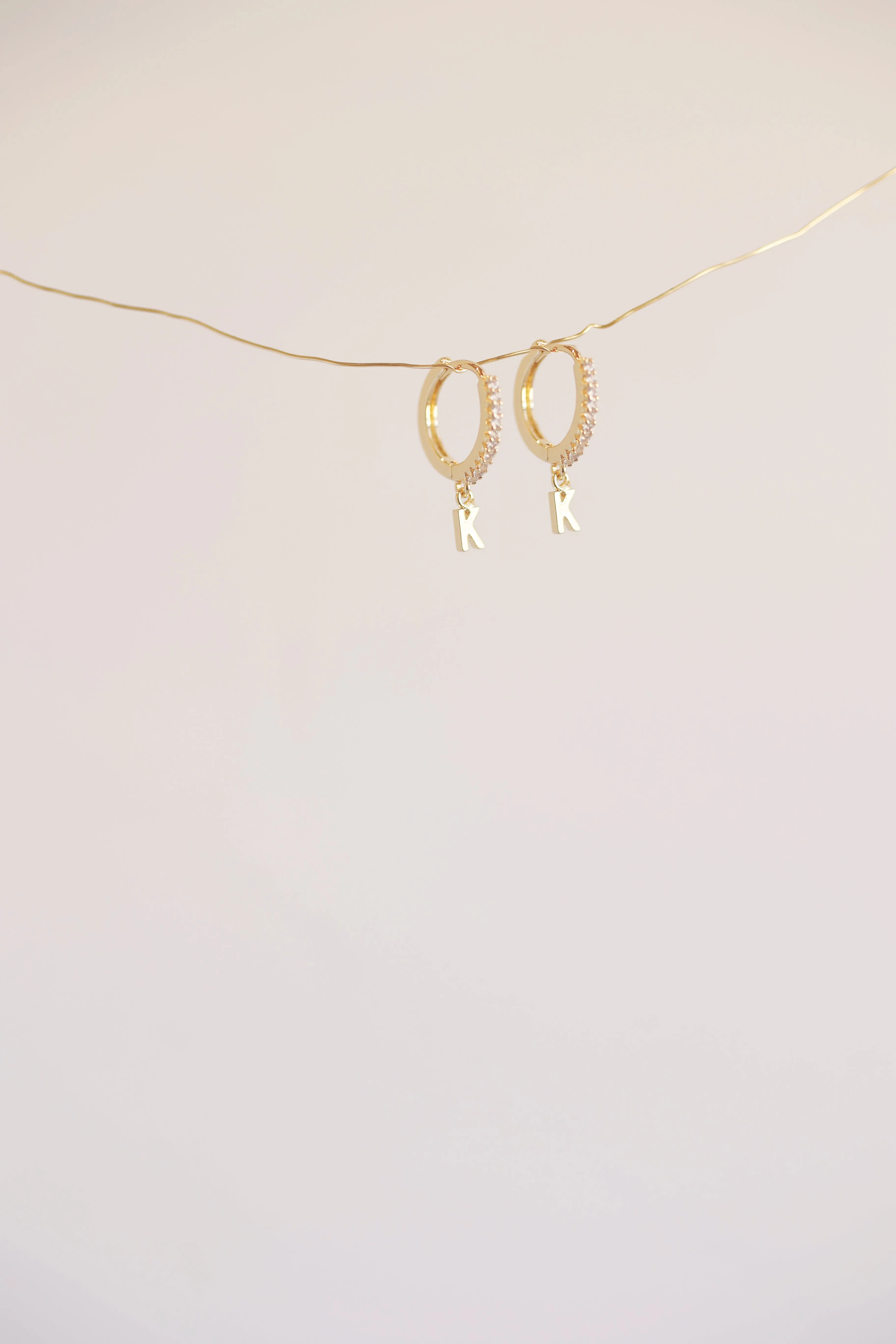 The Mini Monogram Huggie Earrings