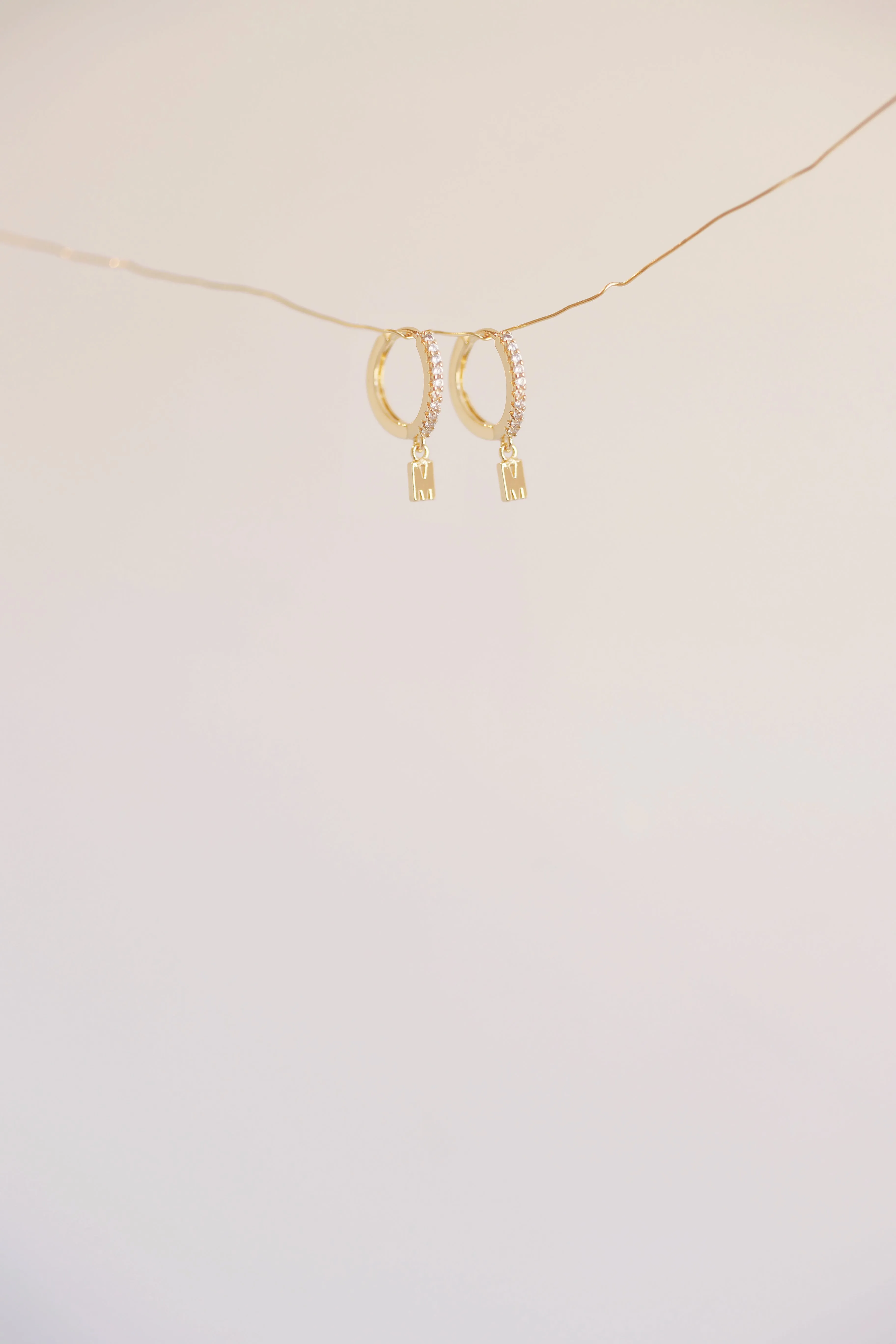 The Mini Monogram Huggie Earrings