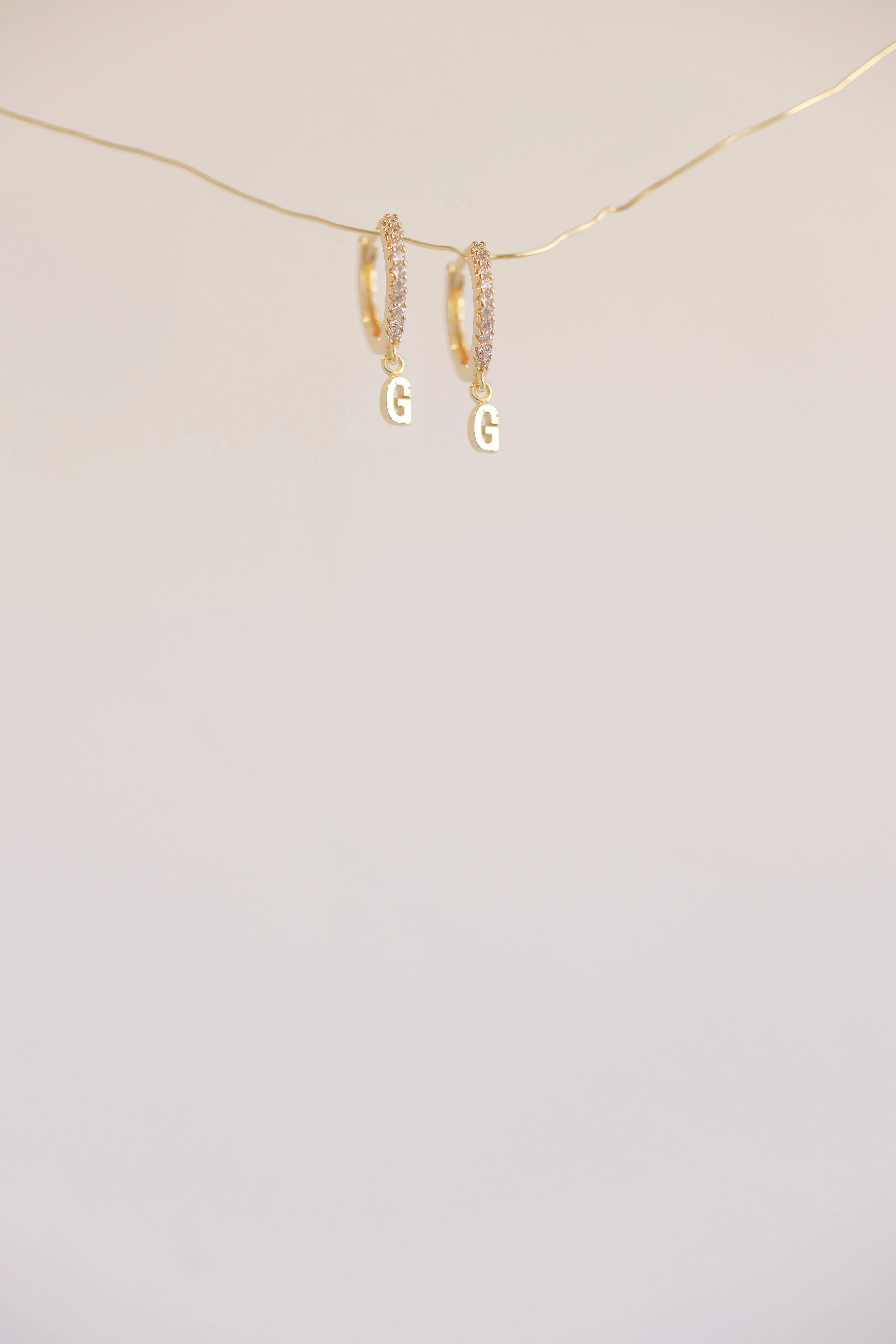 The Mini Monogram Huggie Earrings