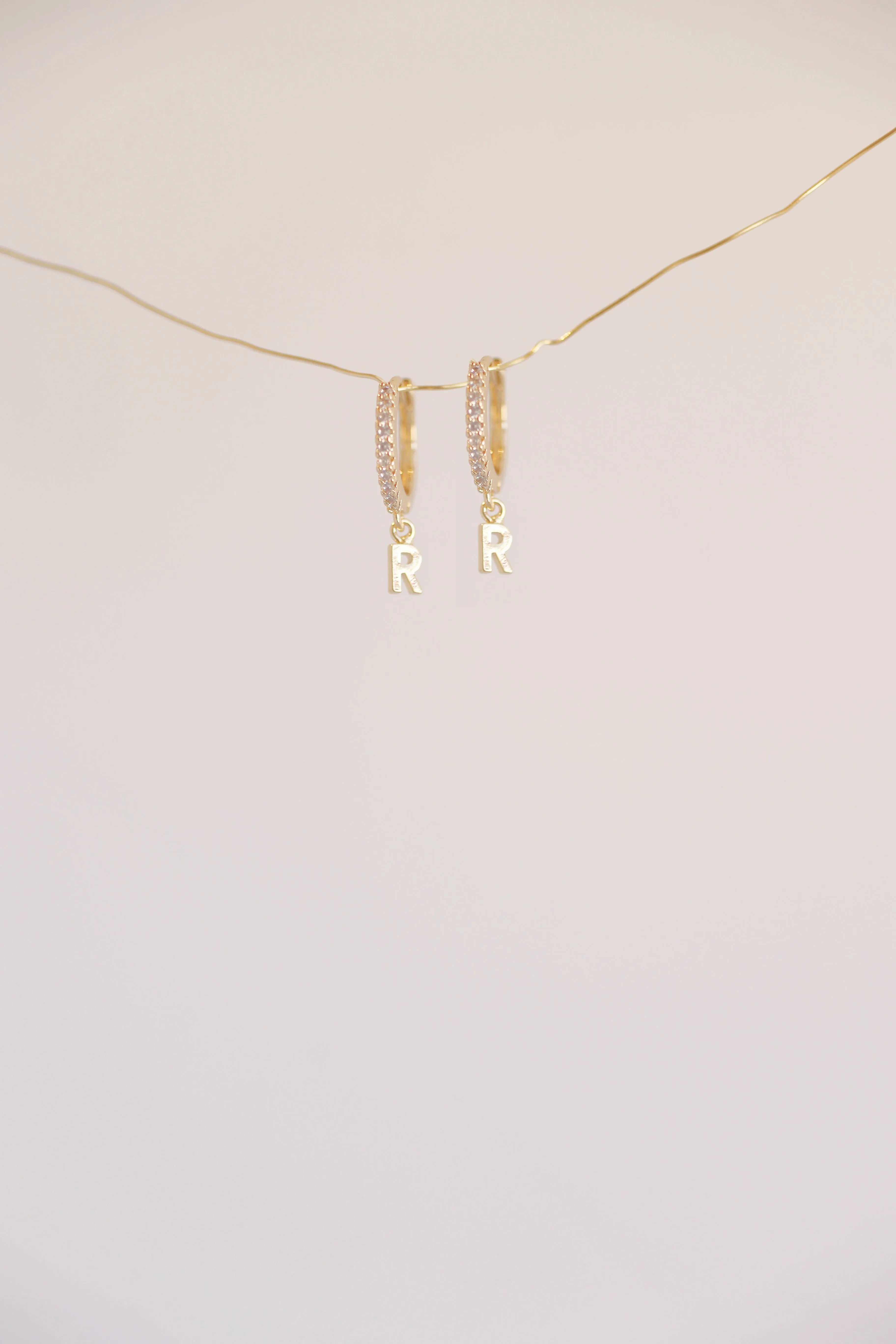 The Mini Monogram Huggie Earrings