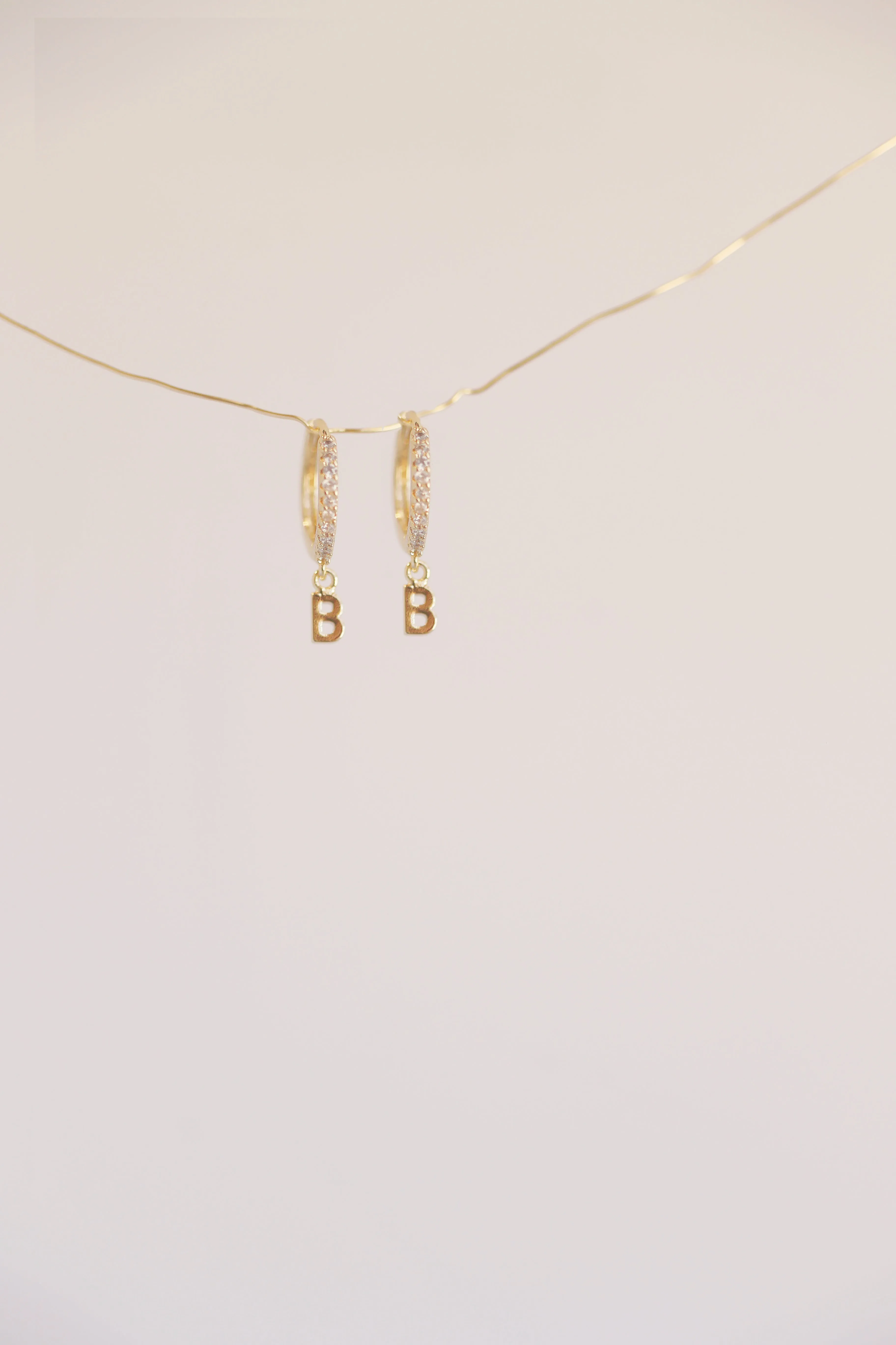 The Mini Monogram Huggie Earrings