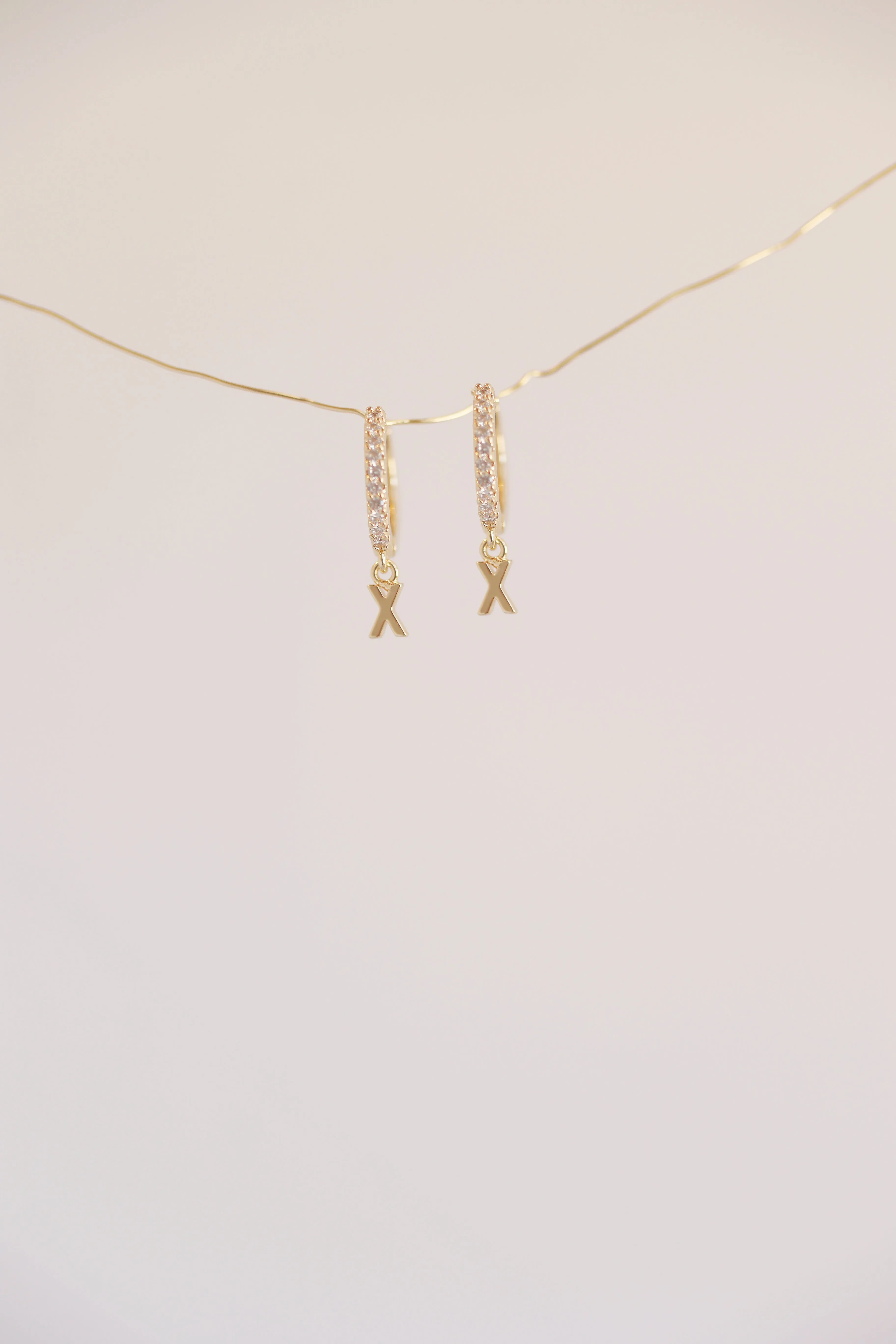 The Mini Monogram Huggie Earrings