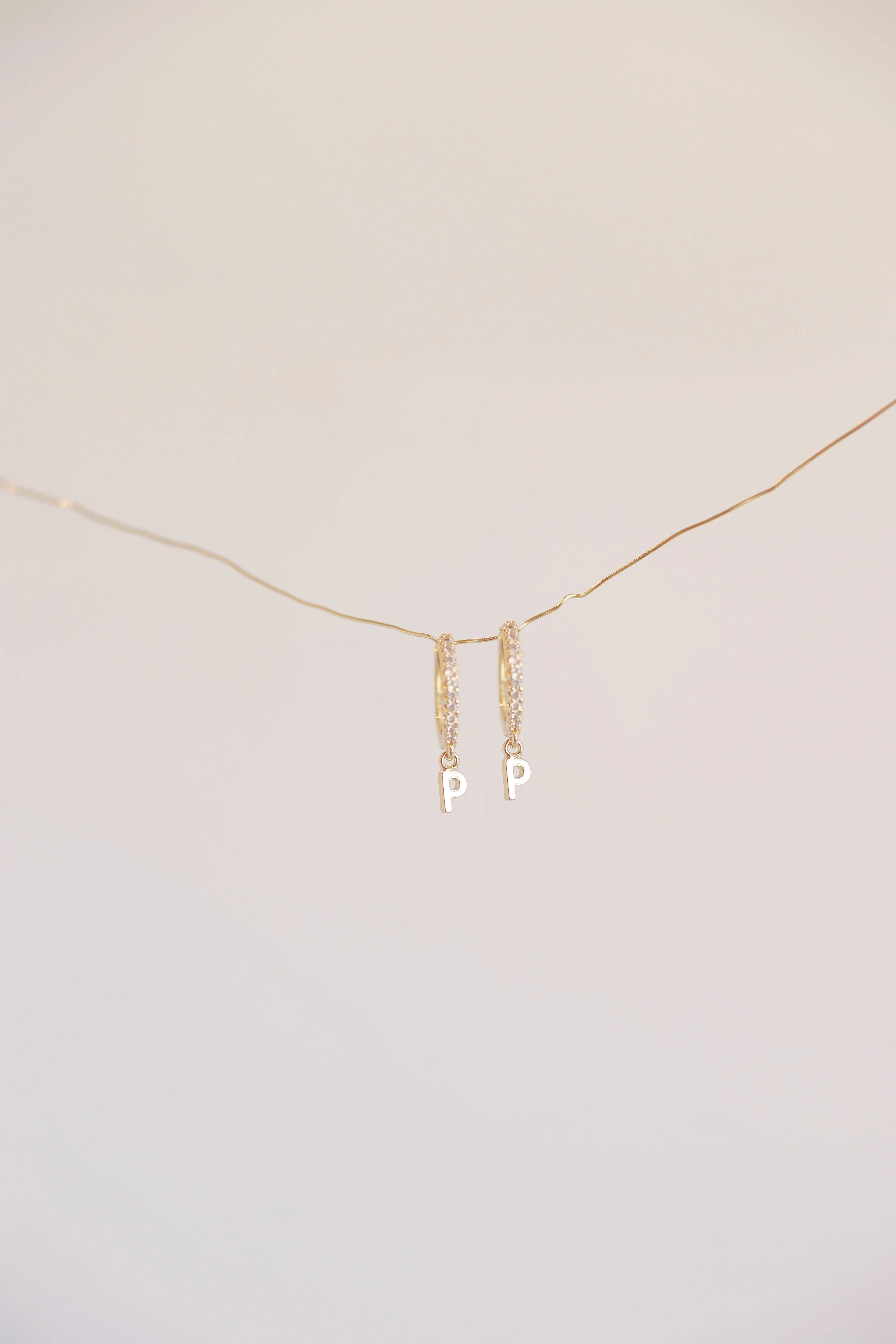 The Mini Monogram Huggie Earrings