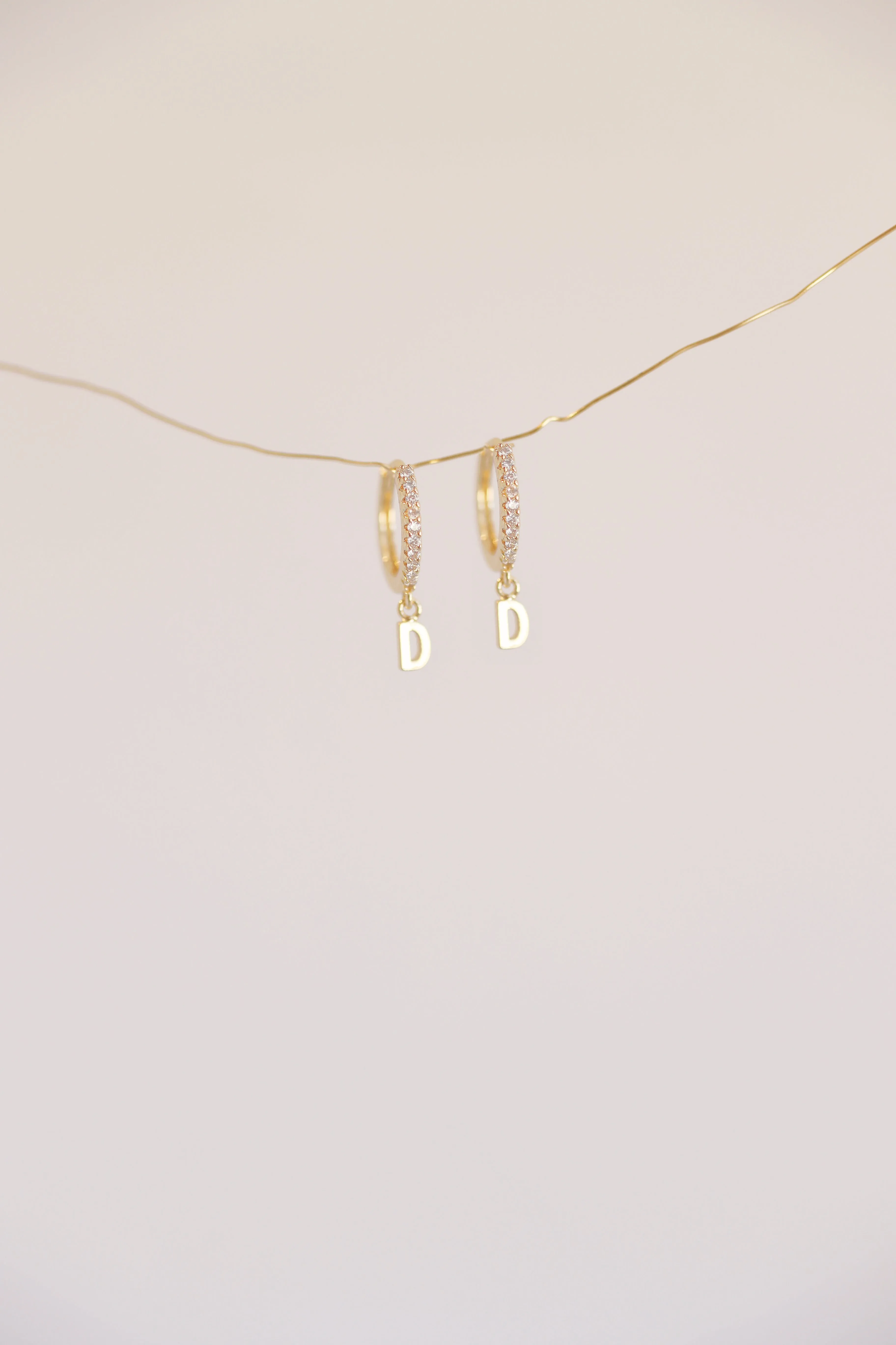 The Mini Monogram Huggie Earrings